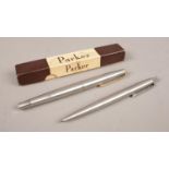 A Parker 45 fountain pen, along with a Parker propelling pencil.