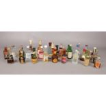 A box of miniature alcoholic drinks. Comprising of Romios Ouzo, Absolut Citron Vodka & Cassis