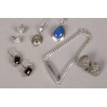 A collection of silver jewellery. Including pendants on chain, earrings, cuff links, etc.