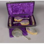 A silver 6 piece dressing table set. Assayed Birmingham 1919 (and other date marks). In a