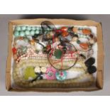 A box of costume jewellery. Including pebble beads, coral, cultured pearls, etc.