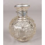 A cut glass globular scent bottle with silver hinged top. Assayed Birmingham 1906 by Charles S Green