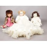 Three assorted dolls. Hanah collectable example One dolls eyes are missing