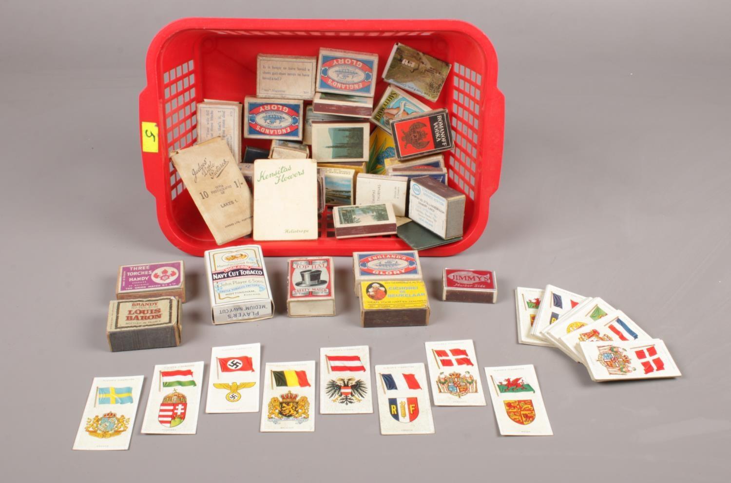 A selection of vintage match boxes (31), together with (approx. 64) player's cigarette cards of