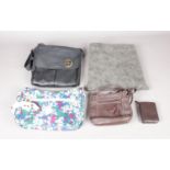 A selection of four handbags and a leather purse. Comprising of a 'Fiorelli' leather bag, a '