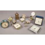 A quantity of miniature clocks. Including Smith's, Anvil, etc.