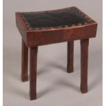 A small mahogany studded leather top stool. (46cm x 36cm x 26cm)