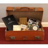 A vintage Pioneer Leather suitcase. containing a group of assorted genre books, Marguerite Patten