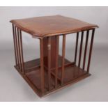 An Edwardian mahogany revolving table top bookcase.