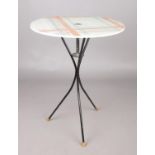 A 1960's Karlsson occasional table, the circular top decorated with a tartan pattern, on a wire