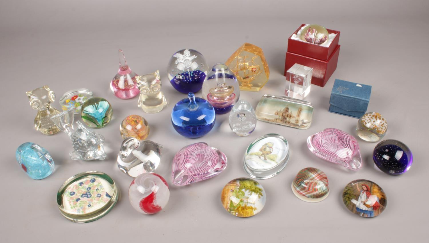 A collection of glass paperweights. Includes Little Red Riding Hood example, floral, animal etc.