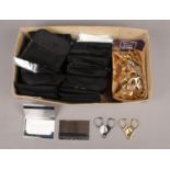 A box containing approx. 36 silver plated card holders, together with approx. 22 Cigar cutters. Card