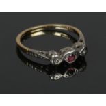 An 18ct gold ruby and diamond ring, marked Ronette. Size M.