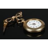 A continental fob watch stamped K18. With 9ct gold bow brooch attachment. Weight of watch is 35.