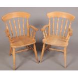A pair of Beech spindle back chairs. H: 89cm, W:57cm, D: 44cm. Some repair has been been done to the