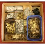 A box containing various metal hinges and door furniture. Condition new.