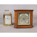 A figured walnut Elliott mantel clock on brass feet. 15cm height. presentation clock. To include a