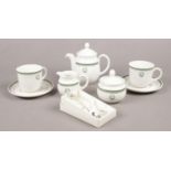 A Royal Doulton tea set for Raffles Hotel Singapore. Teapot, sugar bowl, tea cups/saucers examples