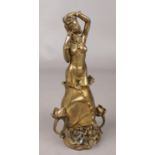 An Art Nouveau style bronze figure of a nude maiden. (27cm).