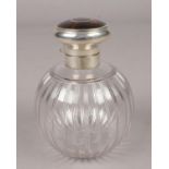 A globular glass scent bottle with silver and tortoise shell hinged top. Assayed Birmingham 1913.