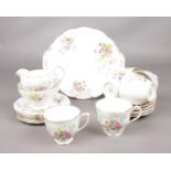 A Queen Anne bone china teaset in the Old Country Spray pattern.