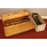A pine wood tool box and collection of tools. Includes planes, saw, hand crank drill etc.