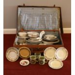 A leather suitcase containing a quantity of ceramics - comprising of three side plates by 'Susie