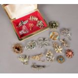 A collection of costume jewellery brooches. Includes paste set and marcasite examples. Four brooches