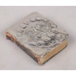 A miniature prayer book with silver cover, decorated with Reynolds angels. Assayed Chester 1913,