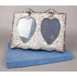 A sterling silver double picture frame - boxed. H: 20cm, W:24cm. Condition good, slight tarnishing