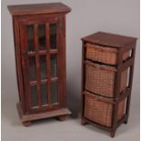 A hardwood panelled glass front side cabinet along with a hardwood and wicker drawer laundry basket.