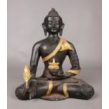 A bronze figure of a seated Buddha adorned with gilt decoration. H: 29.5cm, W: 23cm. Condition good.