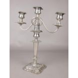 A silver plated triple branch candelabra. H: 41cm, W: 33cm. Condition fair. The plating has worn