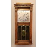 A 1920s Kienzle carved oak wall clock. Westminster chiming. New dial and hands. Movement serviced.