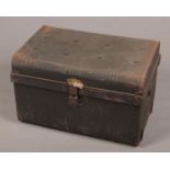 A vintage twin handle tin trunk.