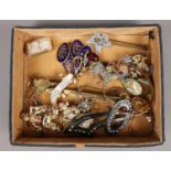 A tray of costume jewellery. Including paste set brooch, boat cuff links, etc.