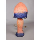 Art Nouveau-style orange and blue mottled glass table lamp with mushroom shaped shade. H: 40cm, W: