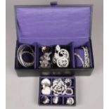 A Jeff Banks jewellery box of white paste jewellery. Including bangles, rings, brooches, etc.
