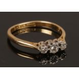 A vintage 18ct gold three diamond stone ring. Size O. Weight 2.33g