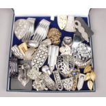 A collection of 32 Art Deco metal and paste dress clips.