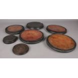 A quantity of early 20th Century circular wooden display bases.