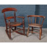 A Victorian mahogany child's rocking chair with bergere seat along with another spindle back child's