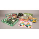 A box of toys. Includes Corgi Silver Jubilee State Landau, Robin tinplate steamboat, squeeze box