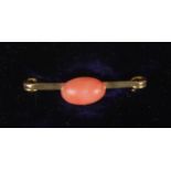 A 9ct gold and coral brooch.