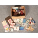 A box of mostly collectables. Including vintage Monopoly board, cigarette cards, set of 6 wet