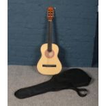 A Eleco acoustic guitar in soft carry case.