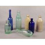 A group of vintage glass/ceramic bottles. J & J Clayton Chesterfield, Holland's Furniture cream