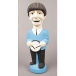 A plaster model of Ringo Starr (Beatles). H: 14cm, W: 8cm.