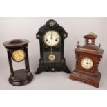 Three 8 day mantel clocks. Including Hamburg example, etc. Front leg of tallest clock loose.