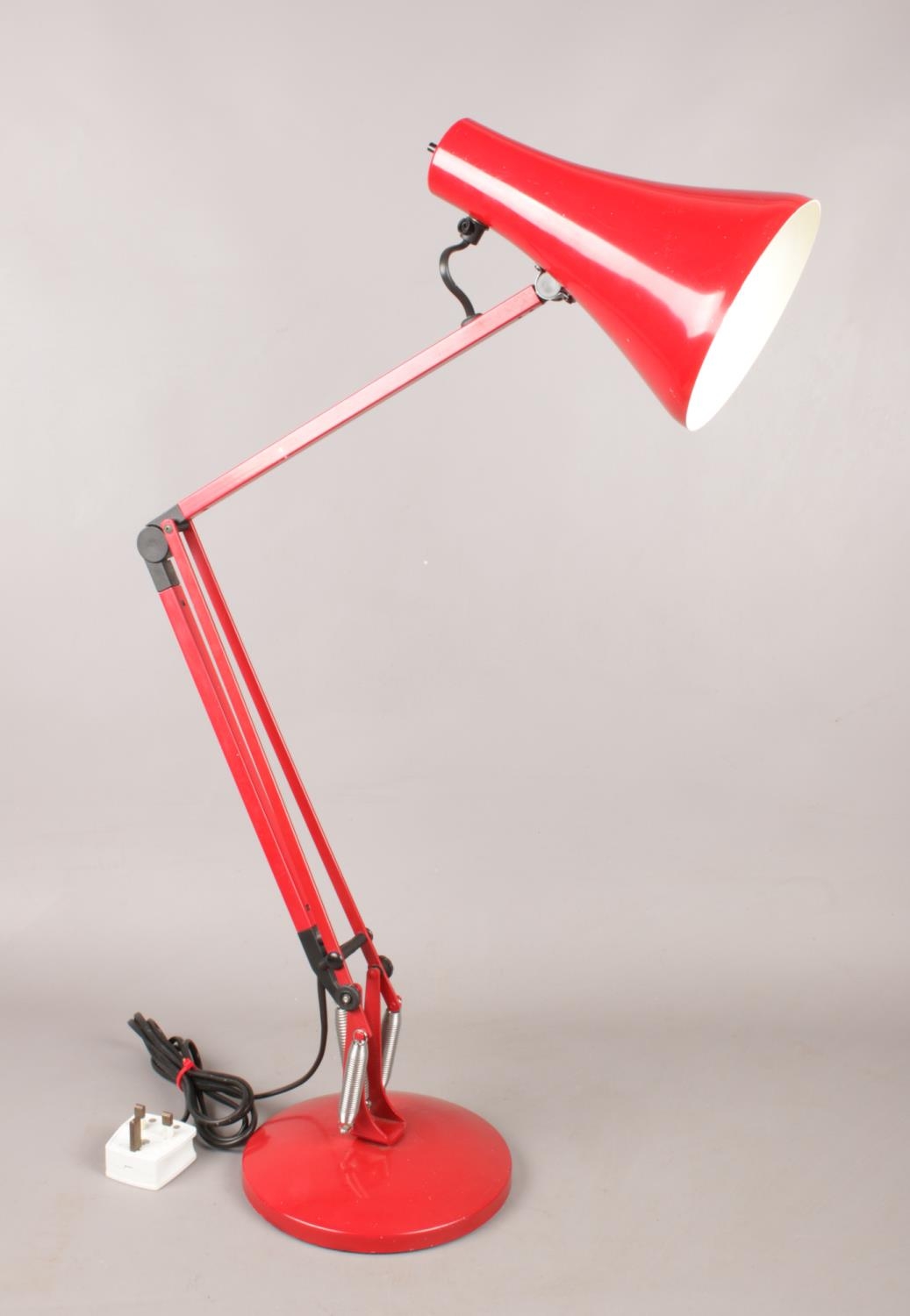 A Herbert Terry Anglepoise Model 90 desk lamp in red. H: 84cm. Condition good. Slight scratches to